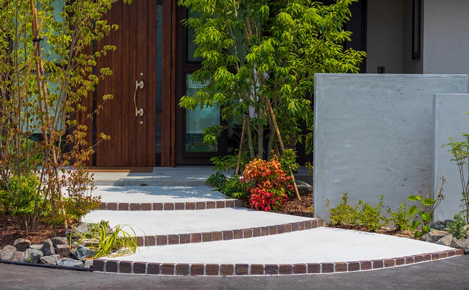 Use this in the work/services showcase as a completed residential exterior case, preferably cropped with enough step detail to show craftsmanship.
